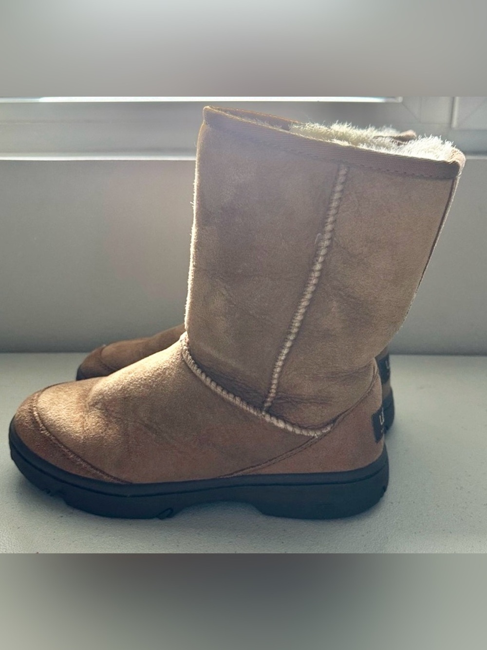 classic UGG Ultimate Short boots in chestnut suede, featuring a cozy shearling